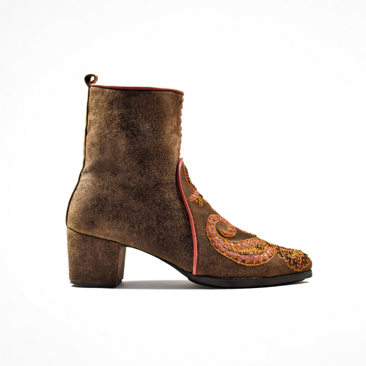 Side view of a distressed brown leather Phyllis Point heeled boot with a pointed toe, block heel and embroidered front panel