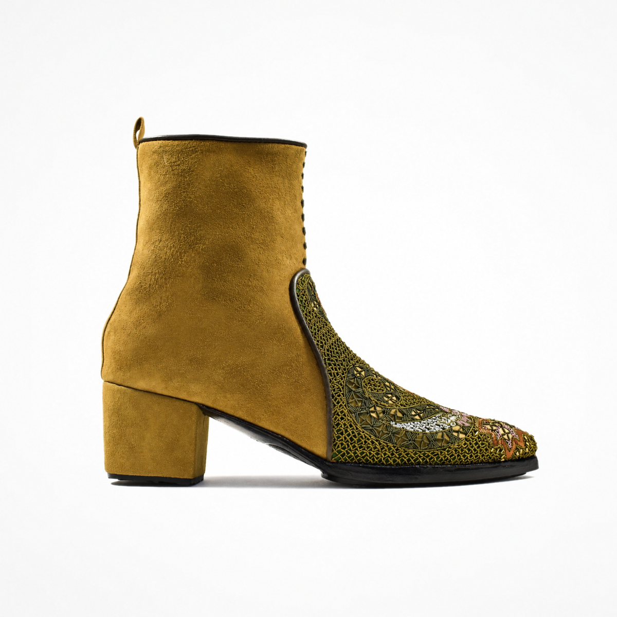 Side view of the ochre suede QUEEN PHYLLIS pointed heeled boot with an olive embroidered front panel and block heel