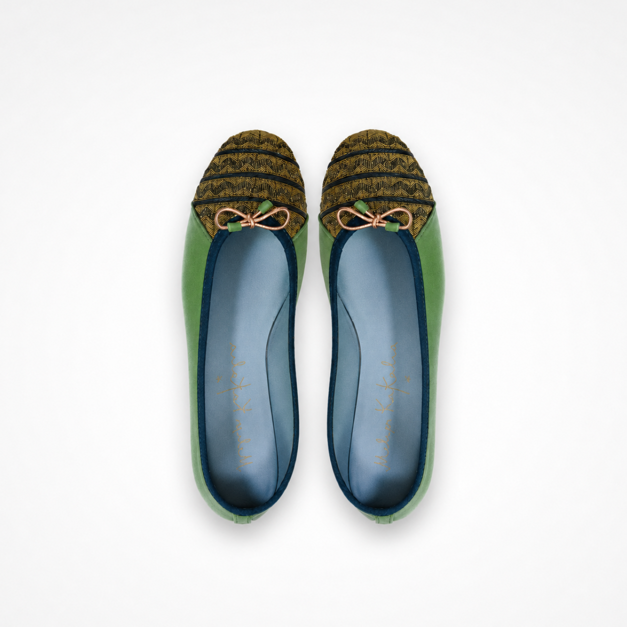 Pair of kelly green Mississippi ballet flats with olive chevron embroidery, blue lining and copper-toned bows