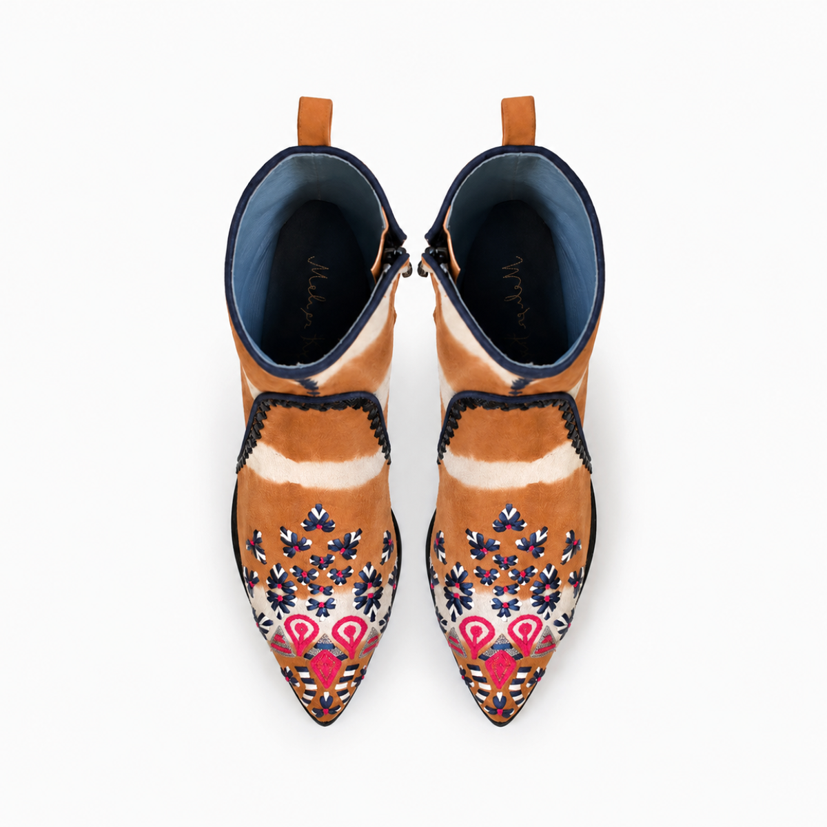 Top view of a pair of orange-and-cream tie-dye suede MANI Point Heeled Boots with embroidered pointed toes