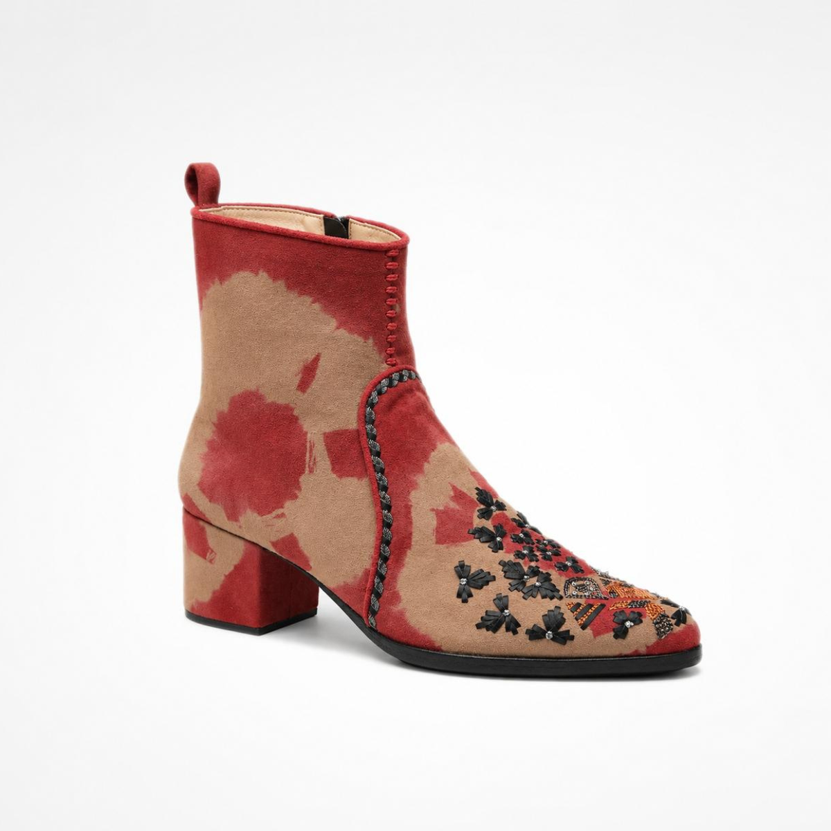 1. Angled view of the red-and-beige tie-dye suede MANI Point Heeled Boot with embroidered pointed toe