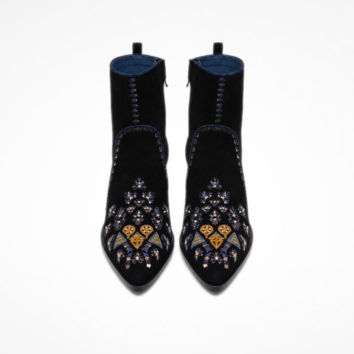 1. Front view of a pair of black suede MANI Point Heeled Boots with embroidered pointed toes