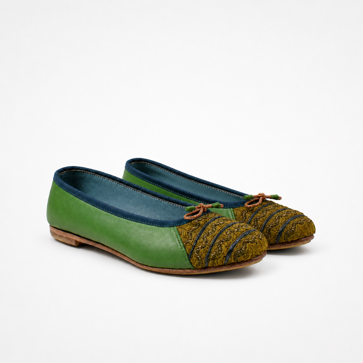 Pair of kelly green Mississippi ballet flats with olive embroidered toe panels and copper-toned bow details