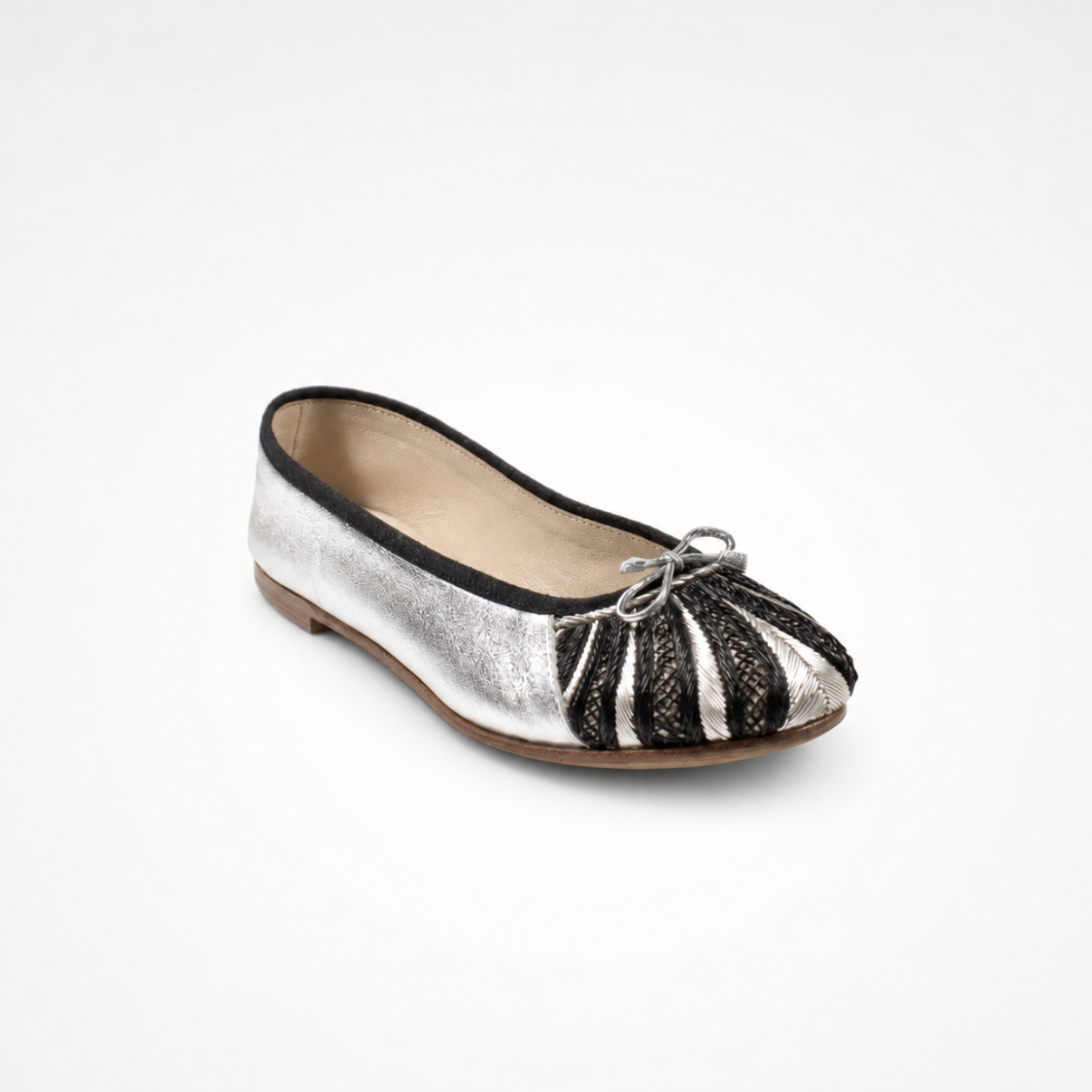 Metallic silver leather Miami Ballet Flat with a rounded embroidered toe, black piping and silver bow