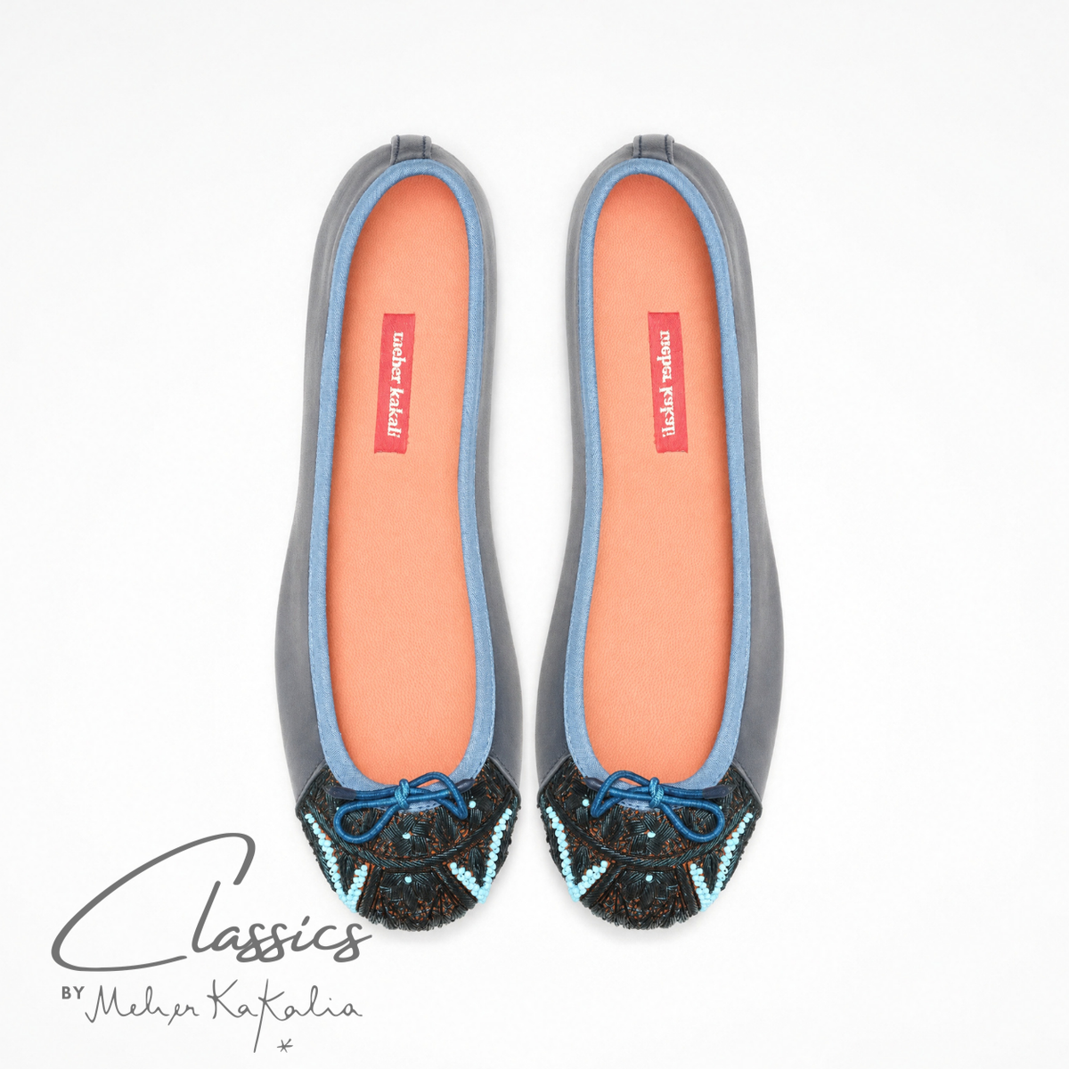 Pair of navy leather BIZI ballet flats with hand-embroidered toe caps, top view