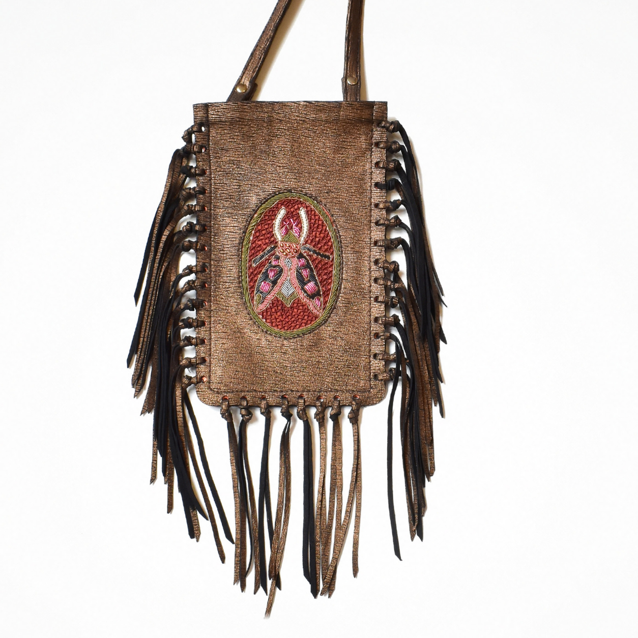 Close-up of the plush copper leather FRINGE Phone Bag with embroidered insect motif and leather fringe