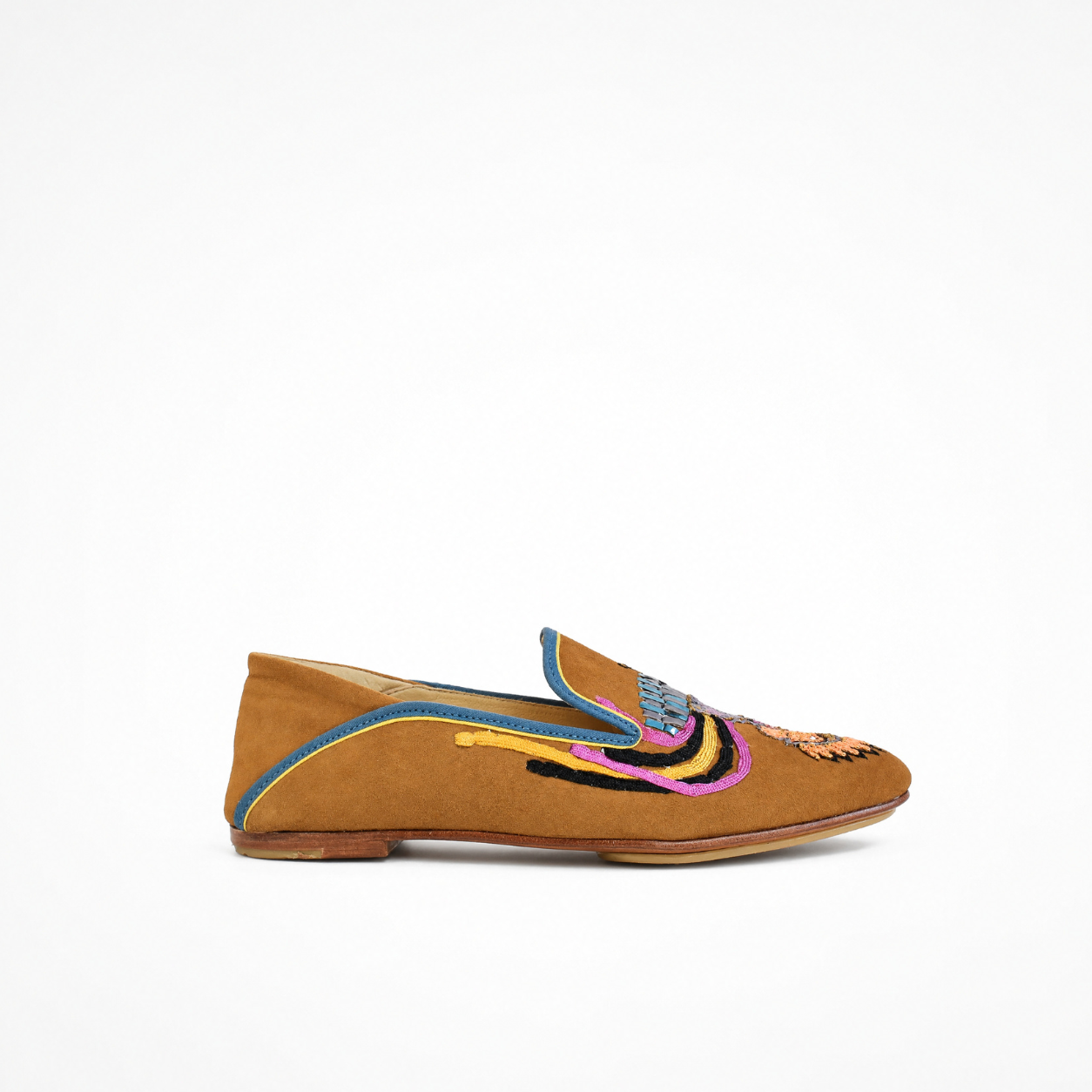 Spice suede moccasin with low-profile sole, embroidered bird detail and contrasting blue trim