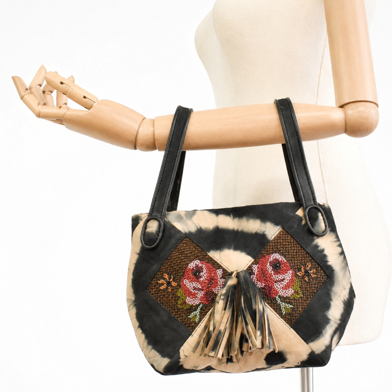 Black and beige tie-dye suede NORA BUNNY BAG held by its leather handles