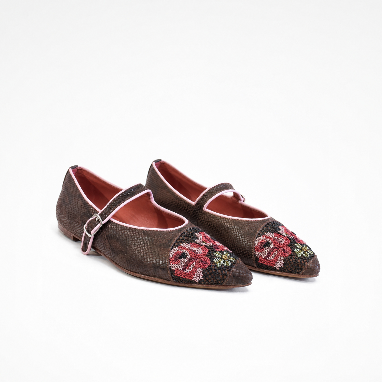 Pair of chocolate-brown textured leather Nora Point Mary Jane ballet flats with floral embroidery and pink piping