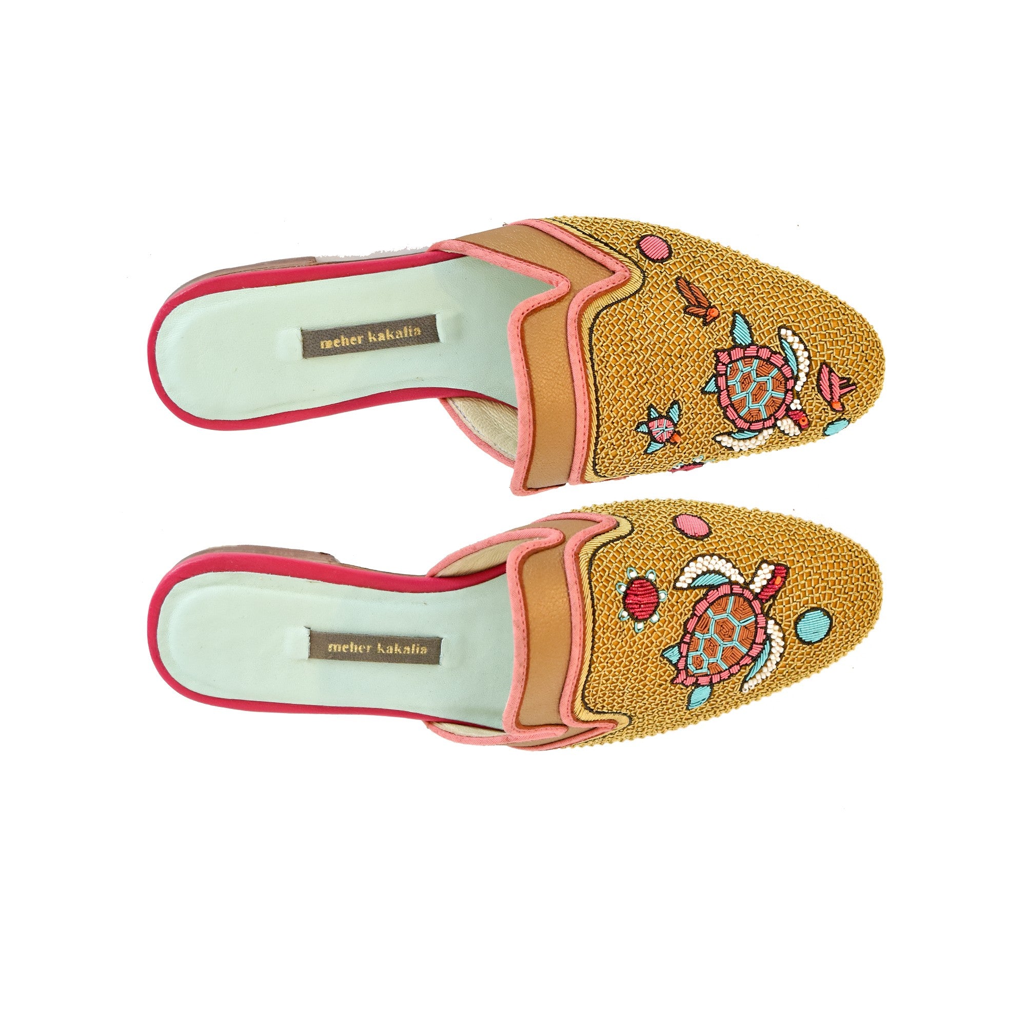 Meher Kakalia's Darwin Slippers in eco leather with turtle embroidery. Handcrafted, sustainable, and ideal for beach vacations.