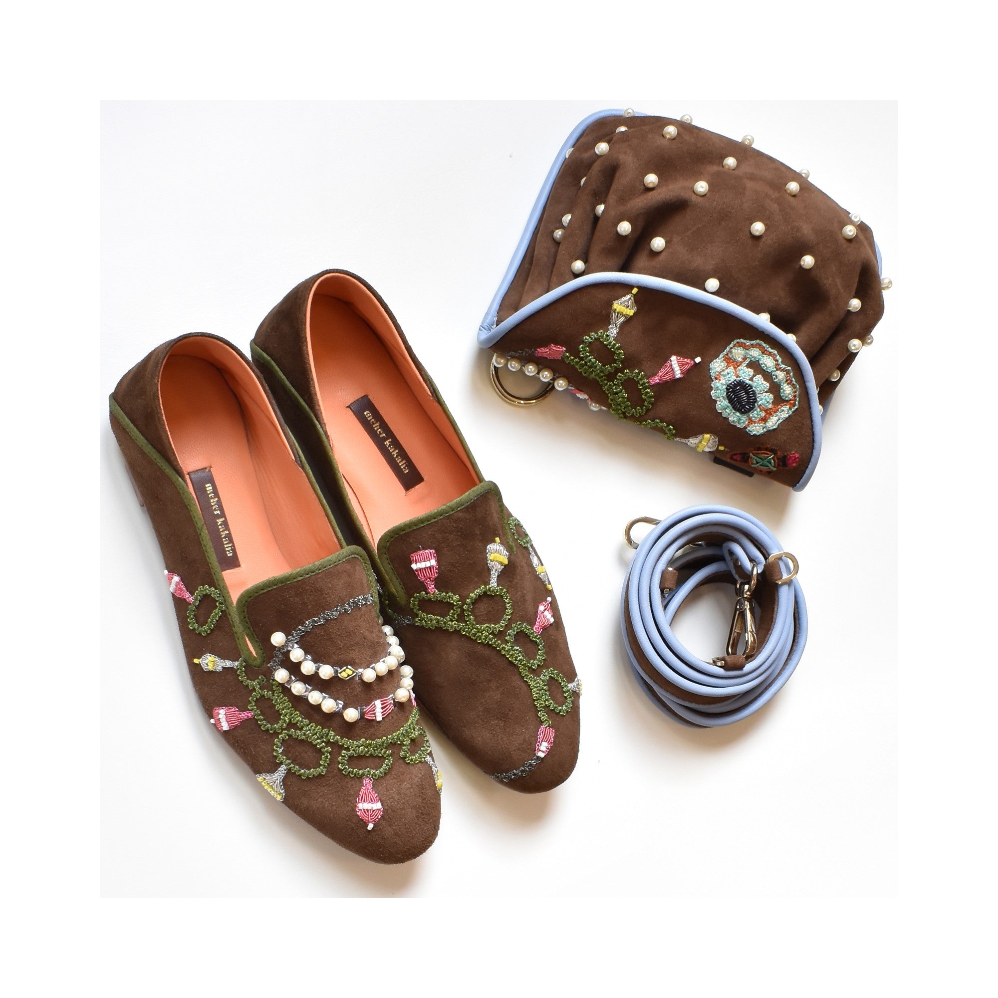 Jewel Accordion suede handbag displayed with matching embroidered loafers and accessories