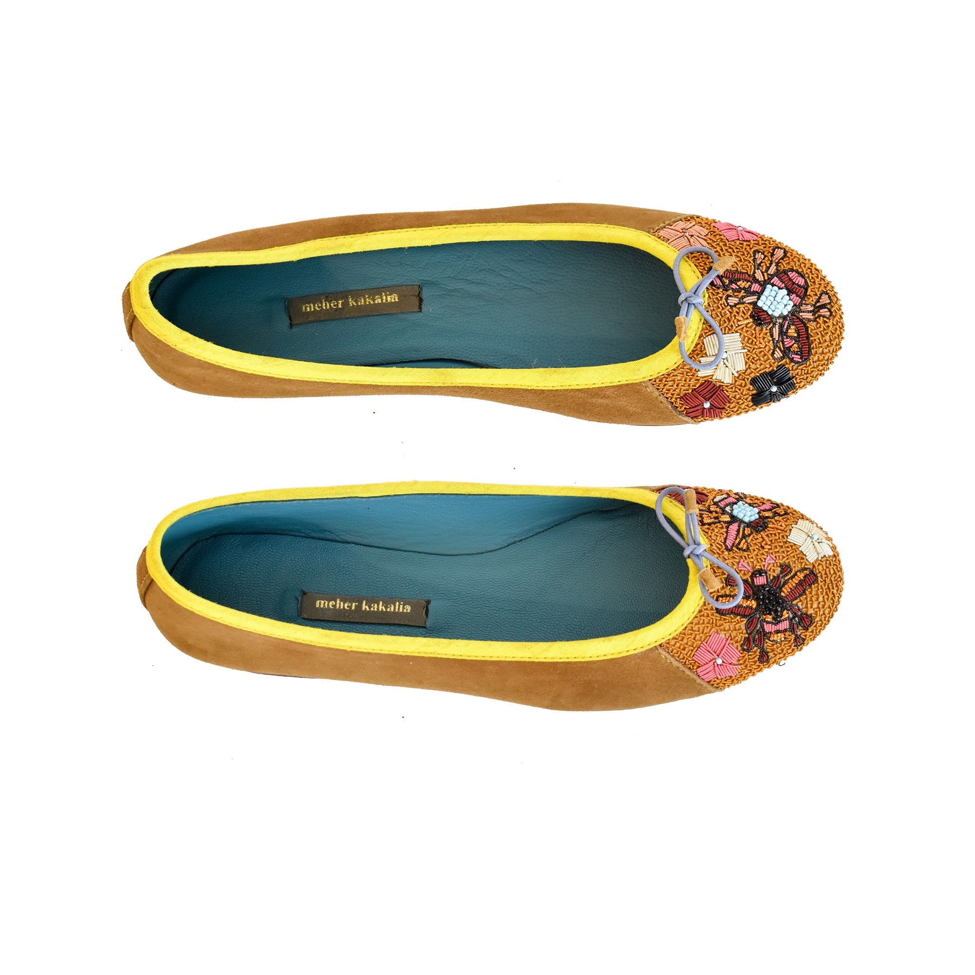 Handmade Ballerinas in camel suede with hand-embroidered bee and flower motifs. Luxury ballerinas crafted for comfort and style.