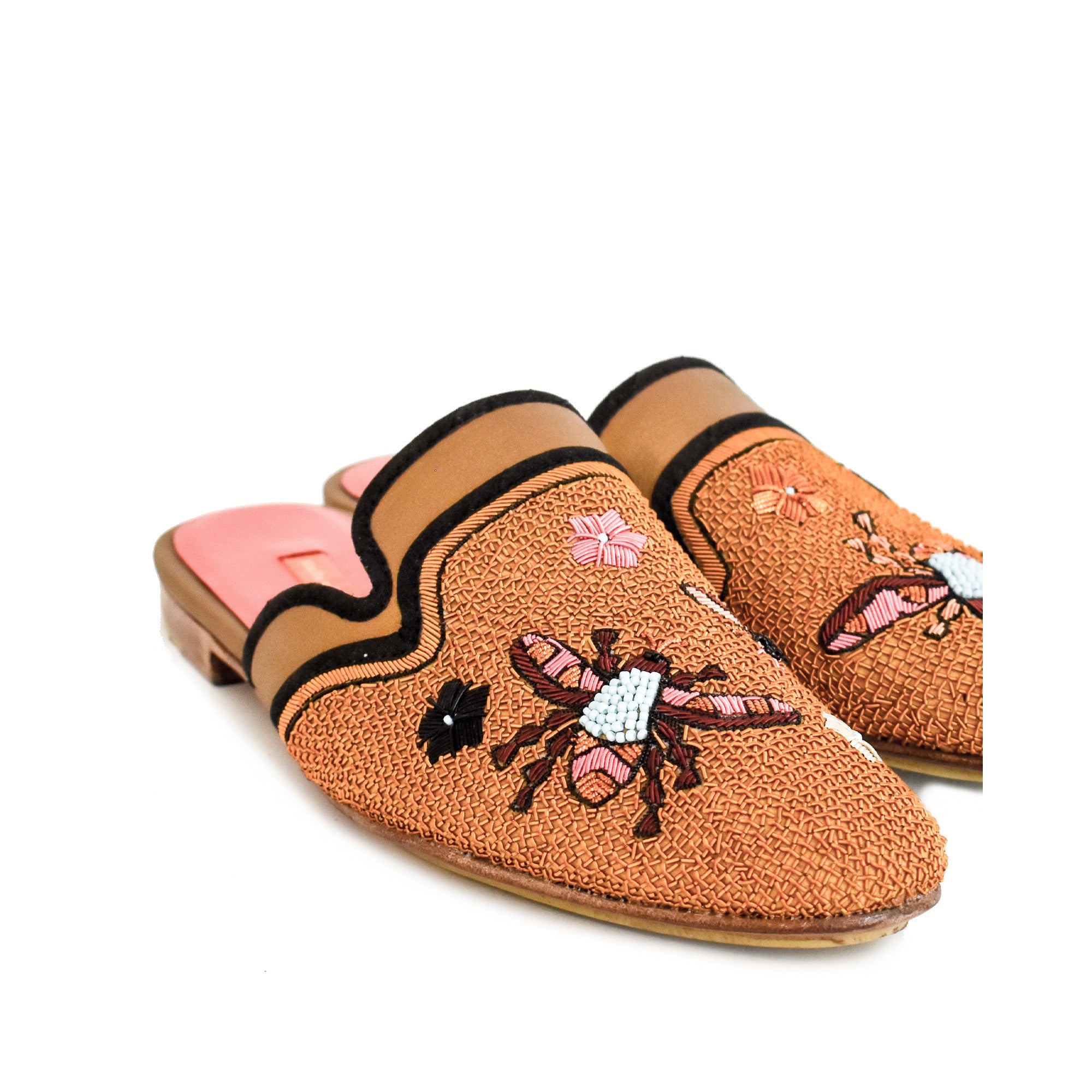 Sustainable embroidered flats with vibrant floral details, ideal for warm weather and casual outfits.