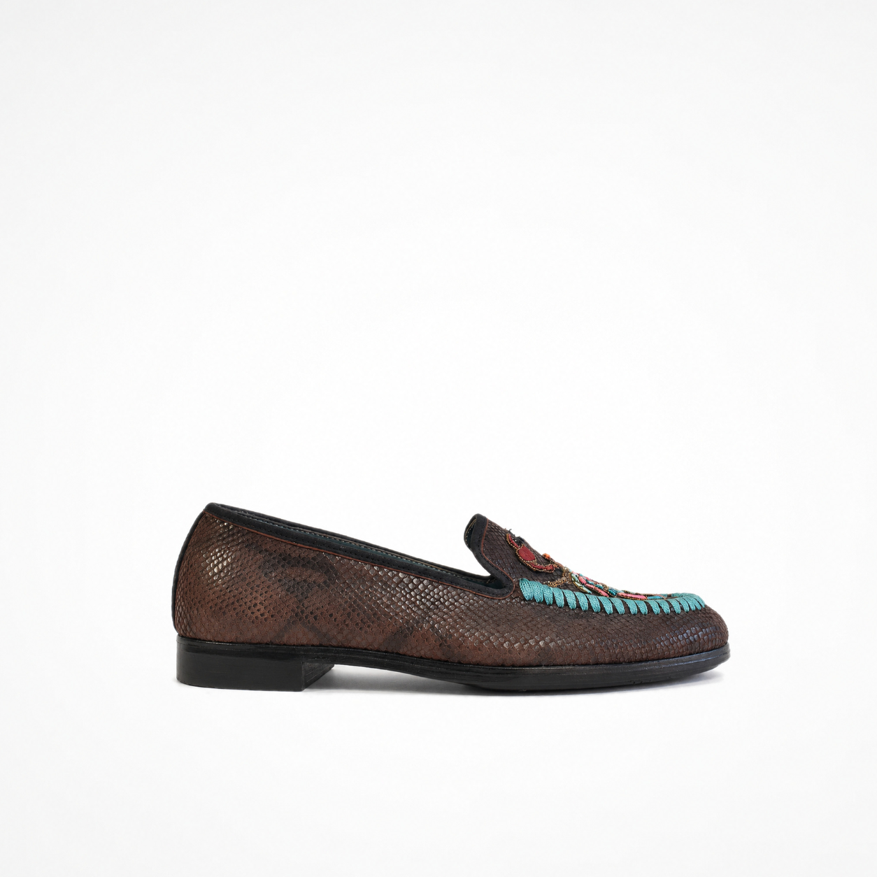 Brown textured leather slip-on loafer with low heel and embroidered vamp