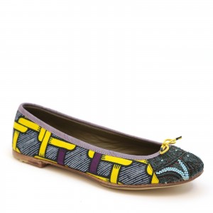 Close-up of BIZI Ballet flat with African-inspired print and yellow bow