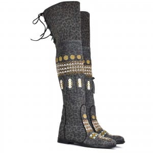 Statement over-knee leopard boots featuring hand embroidery, leather embellishments, and adjustable lace-up back.
