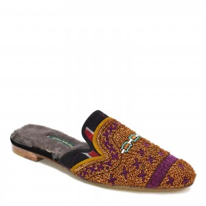 Close-up of hand-embroidered tartan mule slipper with shearling lining