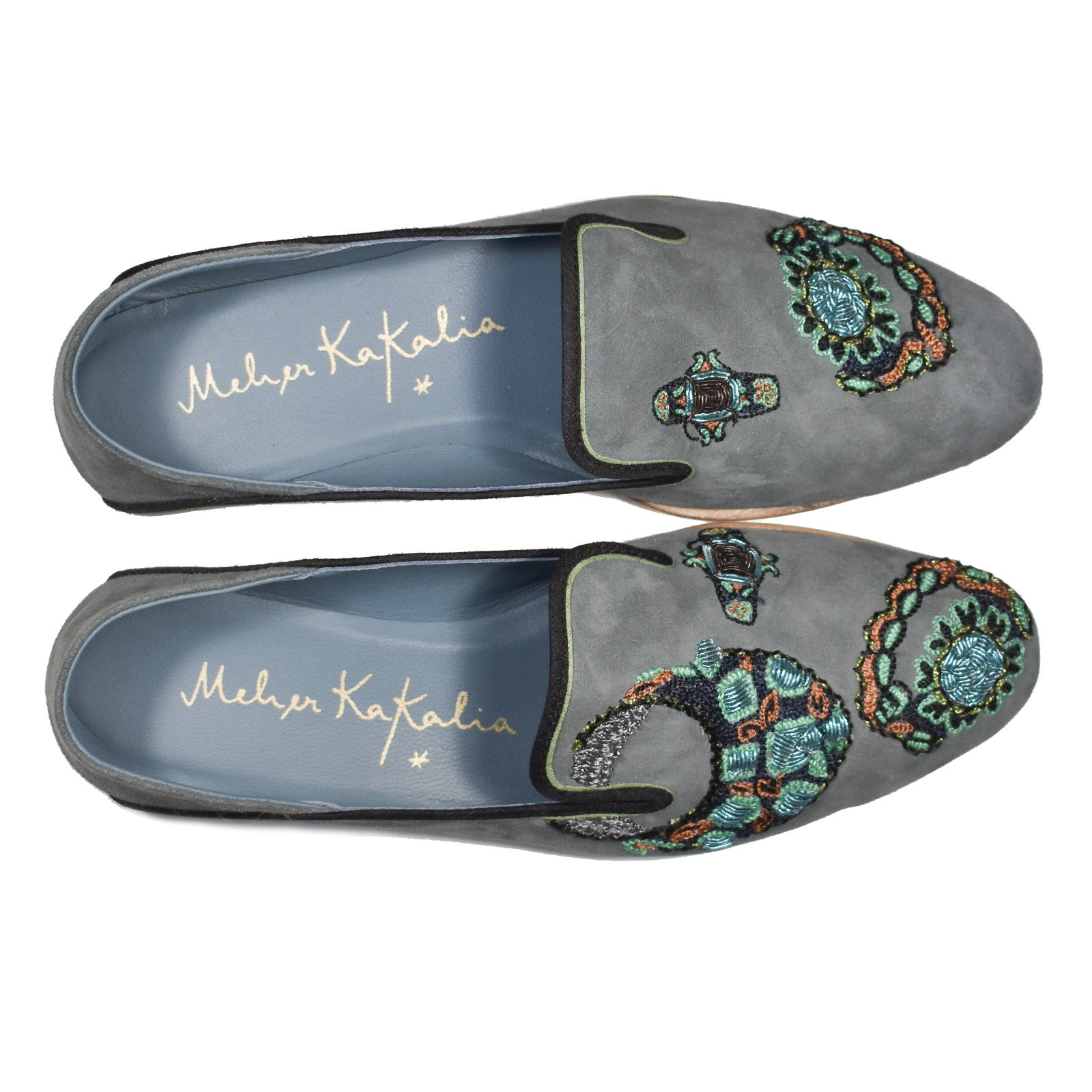 Top view of Meher Kakalia Viti Moccasin in grey suede with ring-inspired embroidery.