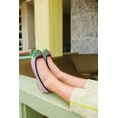 Meher KakaliaLilac suede ballet flats with embroidered green and pink toe worn outdoors