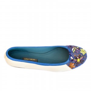 White leather ballet flats with blue floral embroidery and a classic bow, shown from top view.