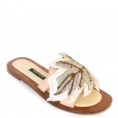 Meher KakaliaMeher Kakalia Palm Gobi Slide in white, crafted from calf leather. Eco-friendly resort footwear for chic summer looks.