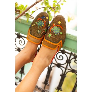 Meher Kakalia’s Darwin Slippers in suede spice-hina. Handmade eco leather slippers with turtle embroidery. Resort style luxury.
