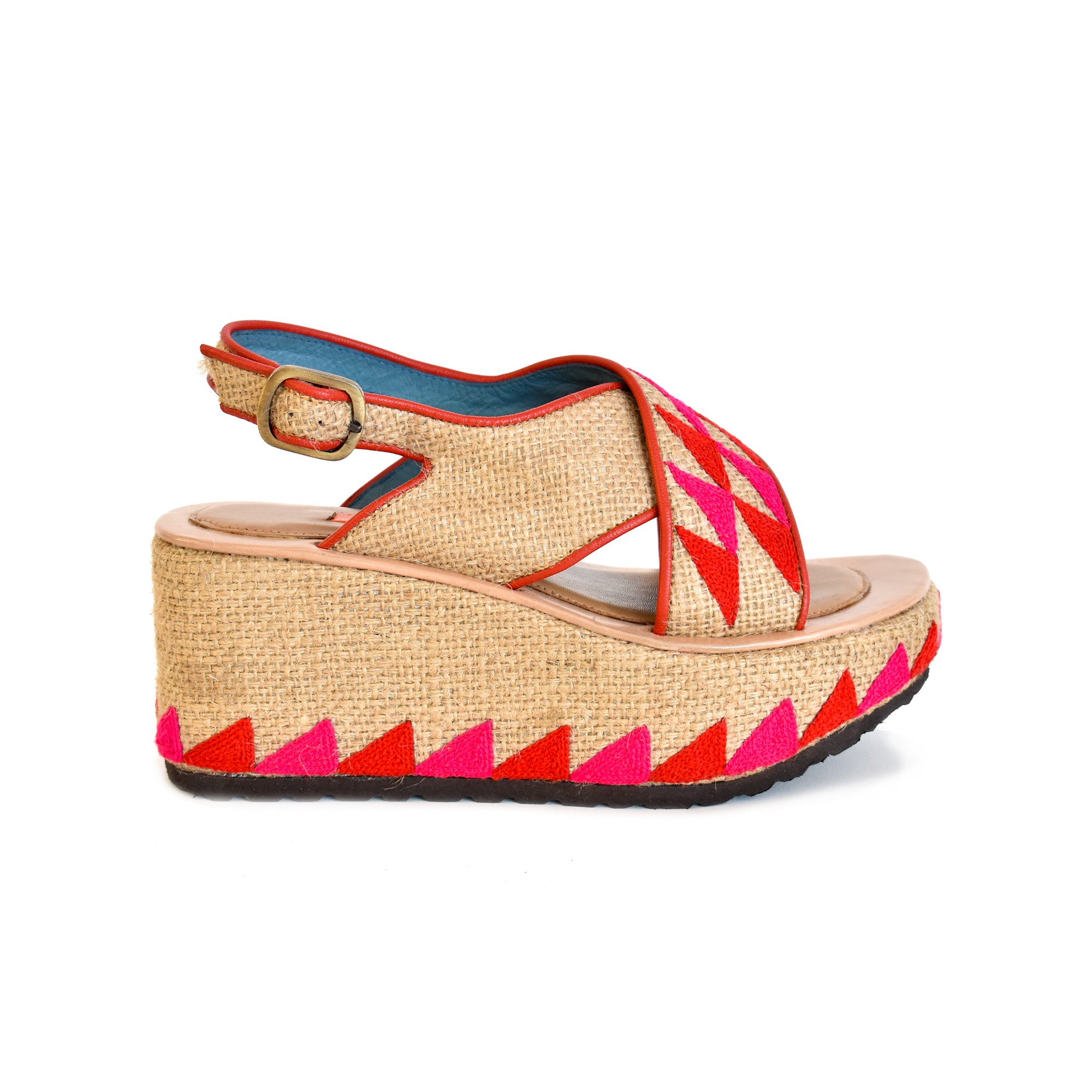 Meher Kakalia Woven jute wedge sandal with coral and pink geometric embroidery and ankle strap.