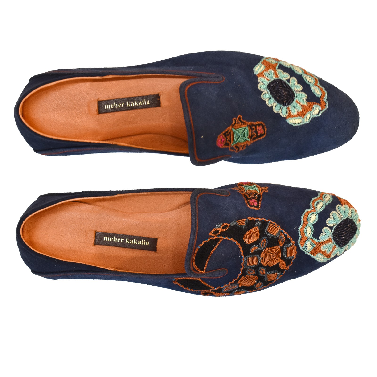 Top view of Meher Kakalia Viti Moccasin in navy suede with ring-shaped embroidery.