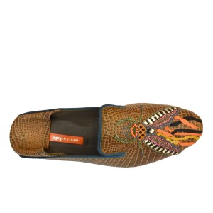 Close top-down view of Meher Kakalia Luna Moccasin with embroidered insect pattern and metallic accents.