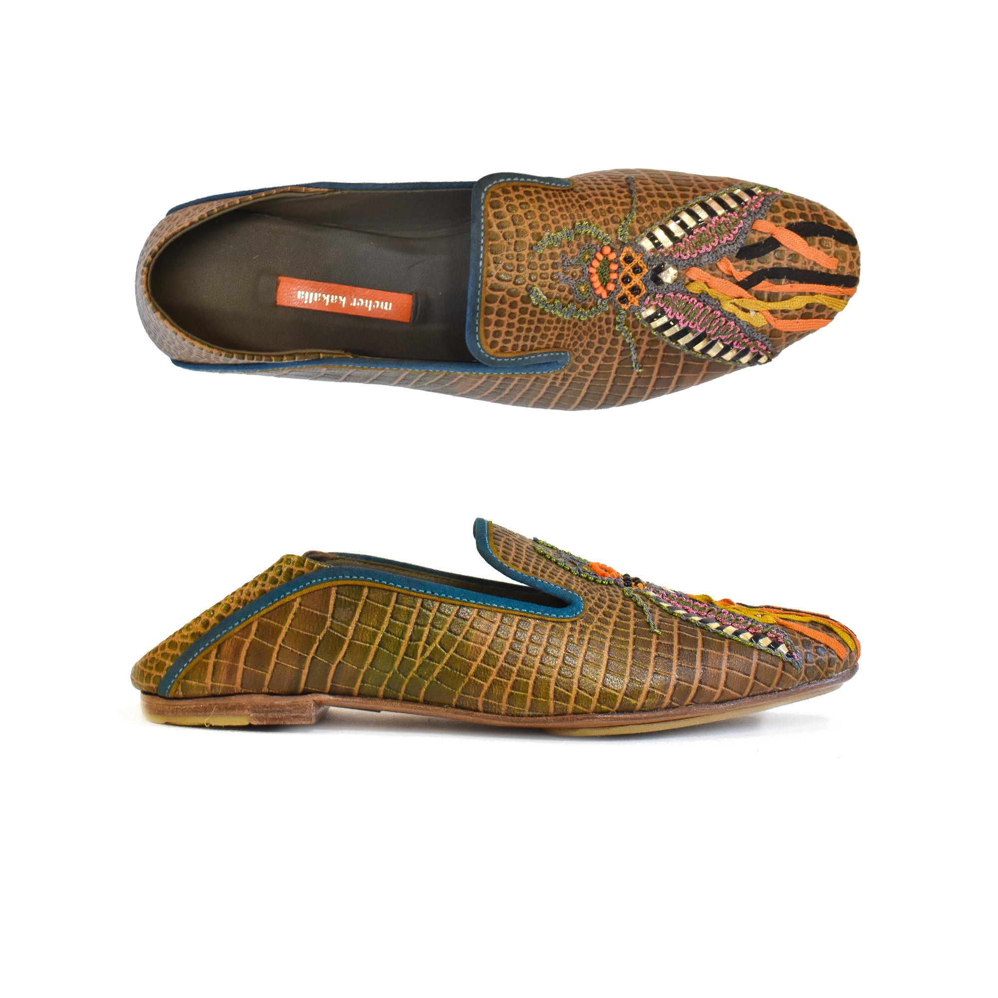 Meher Kakalia Top view of Meher Kakalia Luna Moccasin in croc camouflage leather with hand embroidery and metallic detailing.