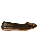Meher KakaliaBlack ballet flats by Meher Kakalia with black and gold embroidery and black trim.