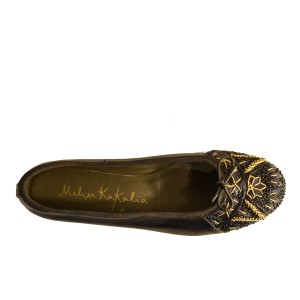 Black ballet flats by Meher Kakalia with black and gold embroidery and black trim.