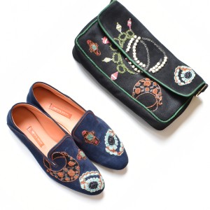 Black Jewel Clutch by Meher Kakalia with embroidered details shown with matching embroidered moccasins.