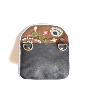 Back view of the Jewel Accordion Bag in suede toffee with leather base and gold hardware.