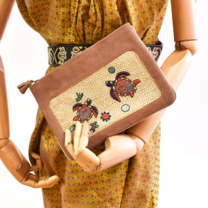Front view of copper peach Darwin Pochette with hand embroidery
