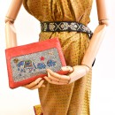 Meher KakaliaMannequin holding the limited-edition coral elephant-embroidered pochette