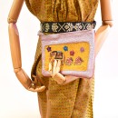 Meher KakaliaBubblegum leather pochette made from small leather stock with ochre embroidered panel