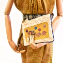 Meher KakaliaSplatter-print leather pochette made from small leather stock with ochre embroidered panel