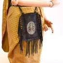 Meher KakaliaStyling the magma black insect-embroidered phone bag