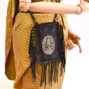 Meher KakaliaSide view of the limited-edition magma black fringe phone bag with long fringes
