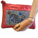 Meher KakaliaCoral elephant-embroidery pochette made from small leather stock, styled