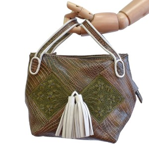 Meher Kakalia Bunny Bag in croc-embossed army leather with hand-embroidered green panels and white tassels.
