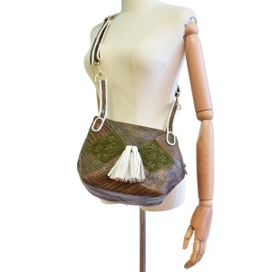 Meher Kakalia Bunny Bag in croc-embossed army leather with hand-embroidered green panels and white tassels.