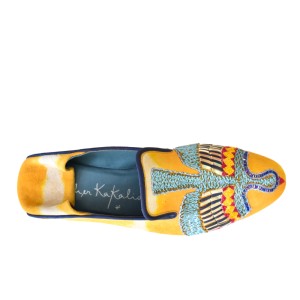 Top view of Meher Kakalia ANZU Moccasin in saffron yellow tie-dye suede with blue hand embroidery and Mukesh metallic detail