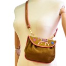 Meher KakaliaBrown suede crossbody bag with traditional coil embroidery and elephant motif.