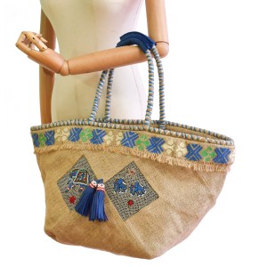 Embroidered jute beach bag with braided handles and leather grip