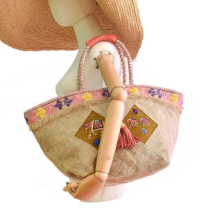 Natural jute basket bag with hand-embroidered elephant panels