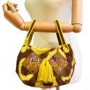 Meher KakaliaBrown and yellow artisan handbag with leather tassels and coil embroidery