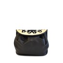 Meher KakaliaSmall accordion-style leather bag in black and white with detachable strap.