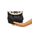 Meher KakaliaCompact black and white leather handbag with gathered base and gold clasps.